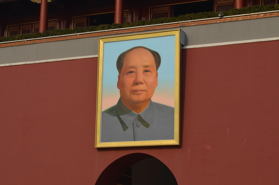 Painting of Mao hanging on building